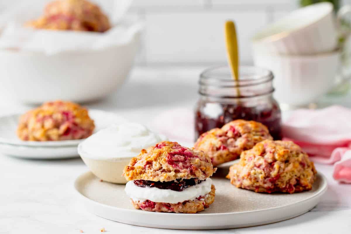 A raspberry drop scone with jelly and cream cheese