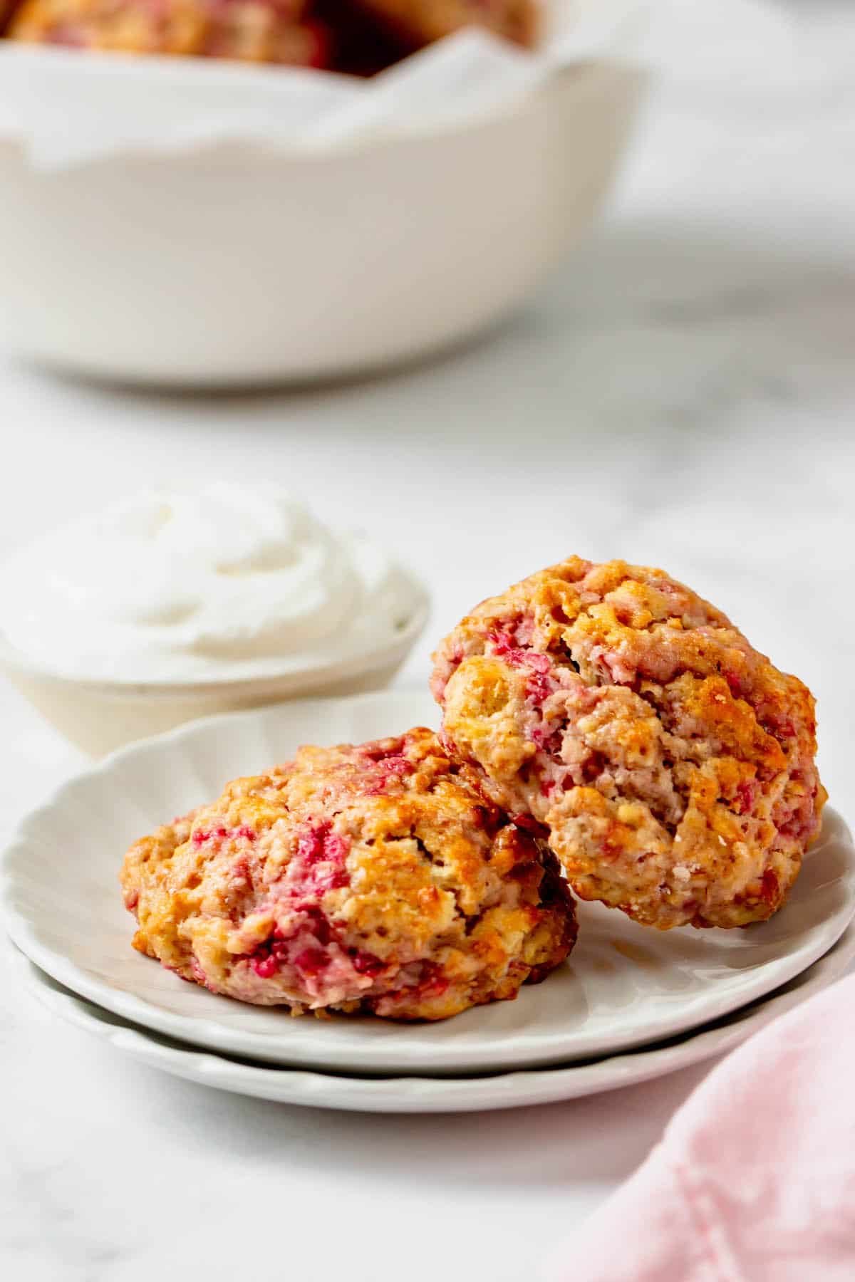 Two raspberry drop scones on a plate