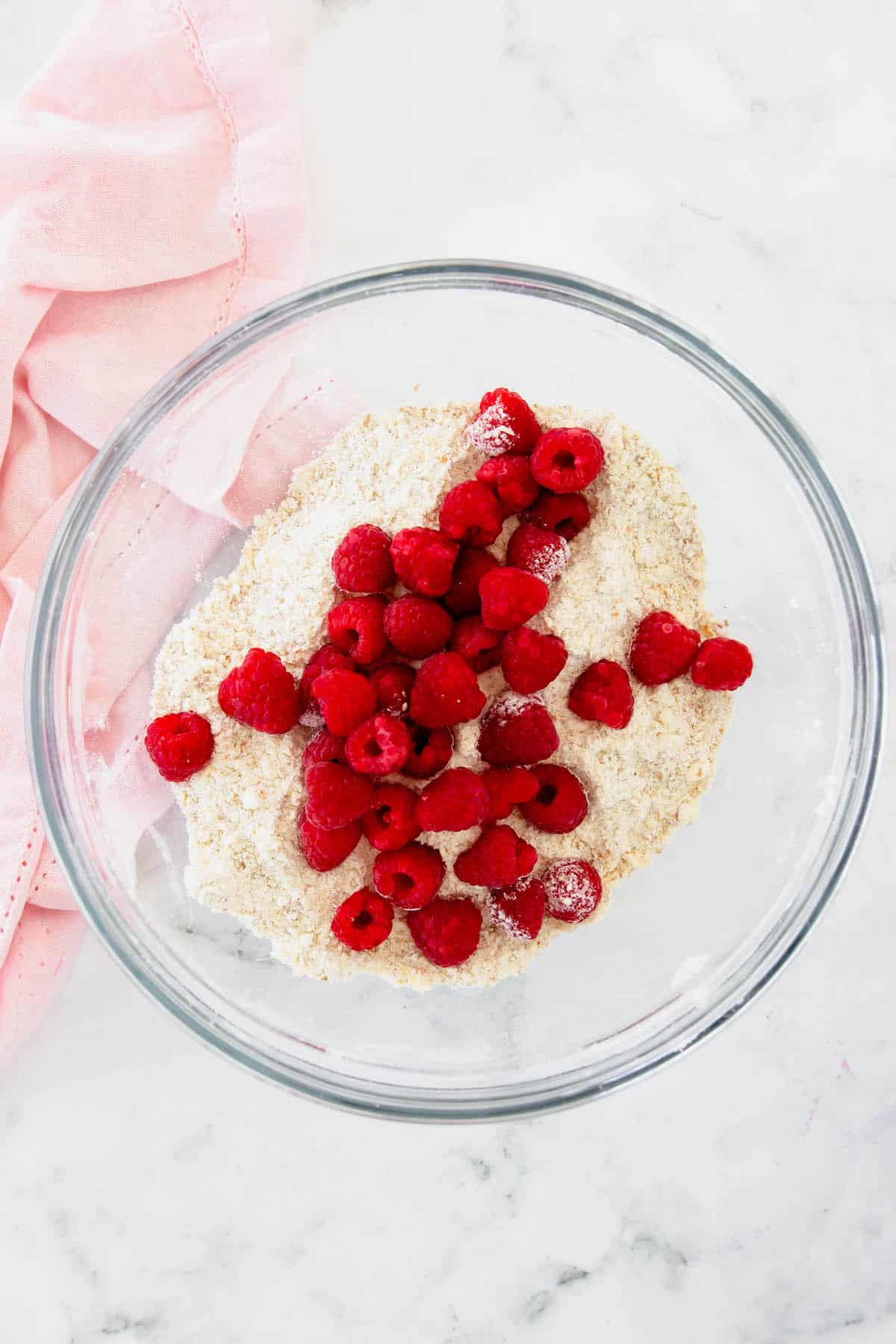 Drop scone batter with raspberries on top