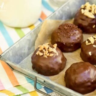a pan of chocolate dipped Peanut Butter Bonbons