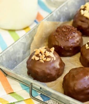 a pan of chocolate dipped Peanut Butter Bonbons