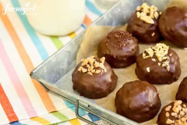 a pan of chocolate dipped Peanut Butter Bonbons