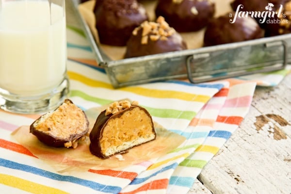 Peanut Butter Bonbons topped with toffee chips and sliced in half