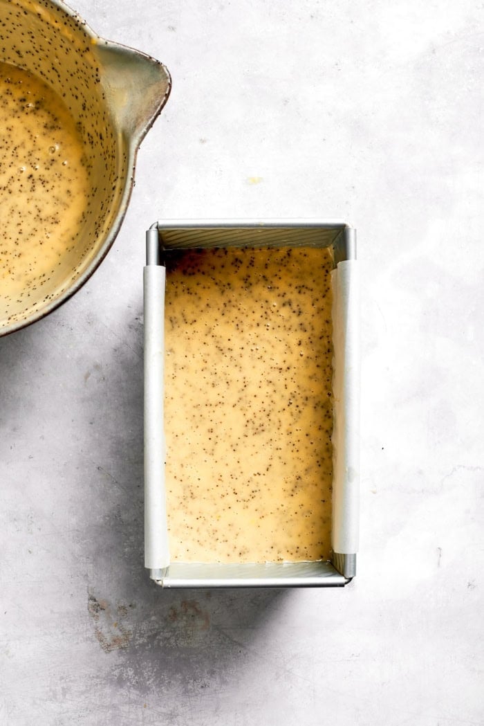 Batter for almond lemon poppy seed bread in pan.