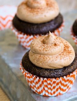 These pumpkin spice cupcakes are filled with pumpkin marshmallow cream and topped with chocolate buttercream.