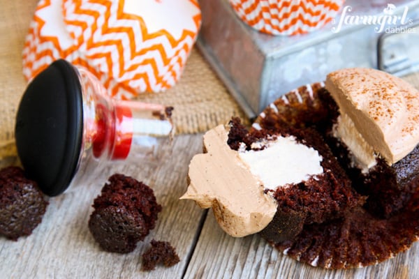 Chocolate Cupcakes sliced in half with Pumpkin Spice Marshmallow Filling and the OXO cupcake coring tool