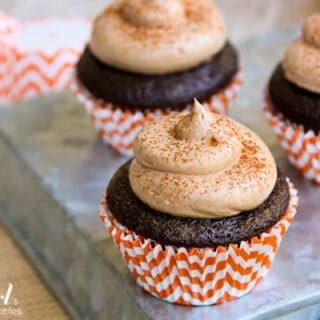 These pumpkin spice cupcakes are filled with pumpkin marshmallow cream and topped with chocolate buttercream.