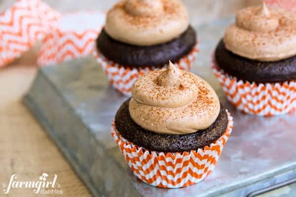 These pumpkin spice cupcakes are filled with pumpkin marshmallow cream and topped with chocolate buttercream.