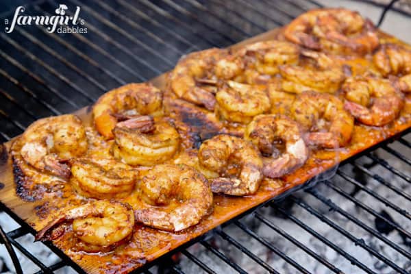 Caribbean Jerk Shrimp Grilling on a wooden plank