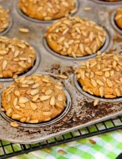 a pan of Pumpkin Muffins topped with Honeycomb Sunflower Kernels