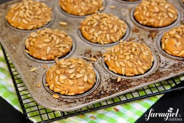 a pan of Pumpkin Muffins topped with Honeycomb Sunflower Kernels