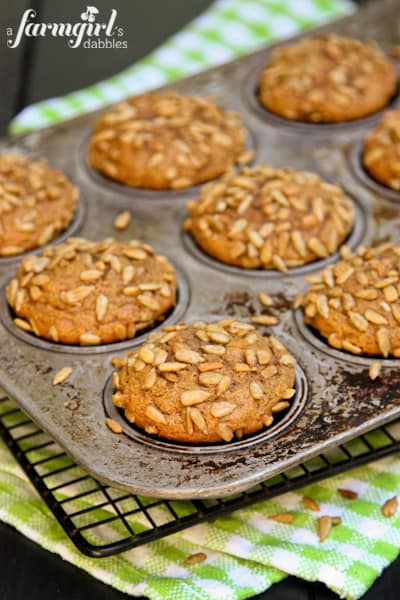 a pan of Pumpkin Muffins on a cooling rack