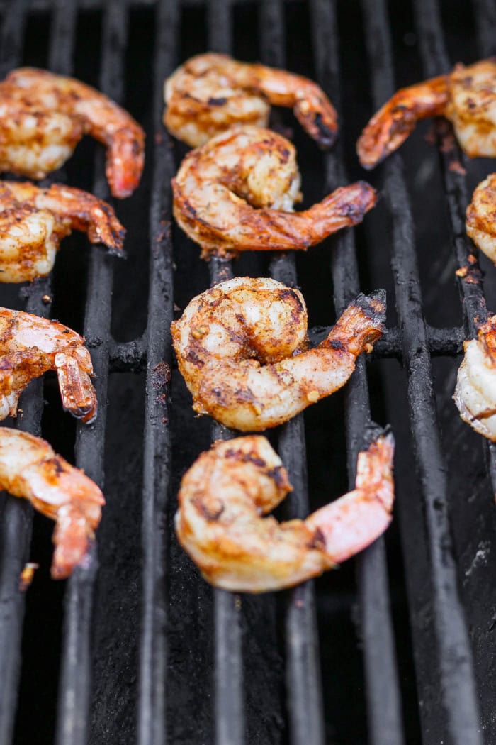 Jerk shrimp cooking on grill