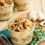 Individual glass jars of Potato Gratins topped with Bacon and Mushrooms