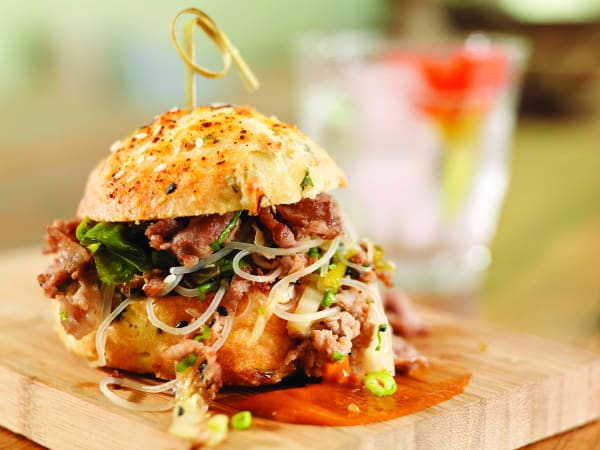 Shaved Pork-Umms sandwich with scallion, sesame BBQ, and kimchee biscuit