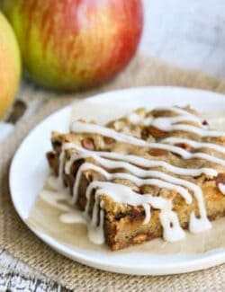 a slice of an Apple Bar with whole, fresh apples