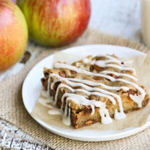 a slice of an Apple Bar with whole, fresh apples
