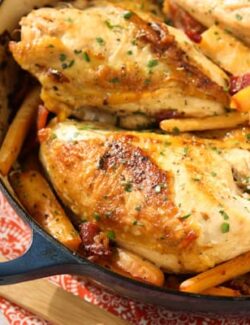 chicken breasts, hard cider, parsnips in a dark blue casserole dish