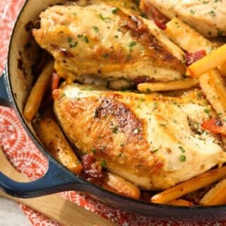chicken breasts, hard cider, parsnips in a dark blue casserole dish