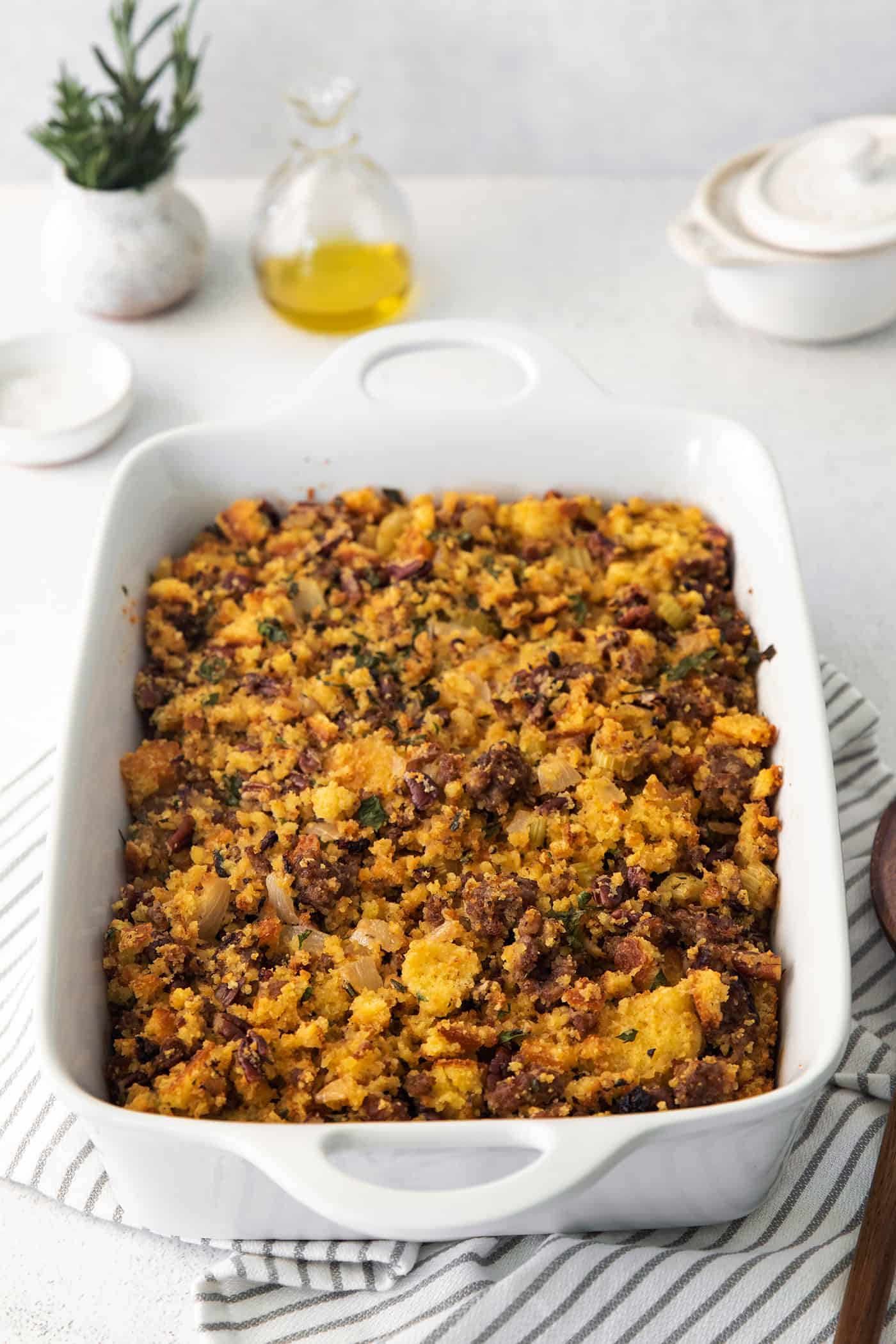 Cornbread dressing in a white casserole dish