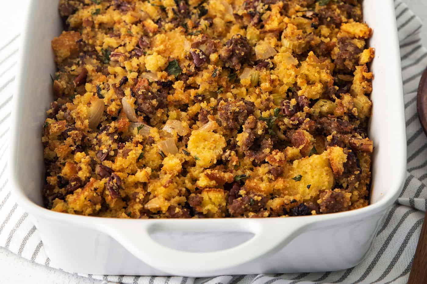 Cornbread dressing in a white casserole dish