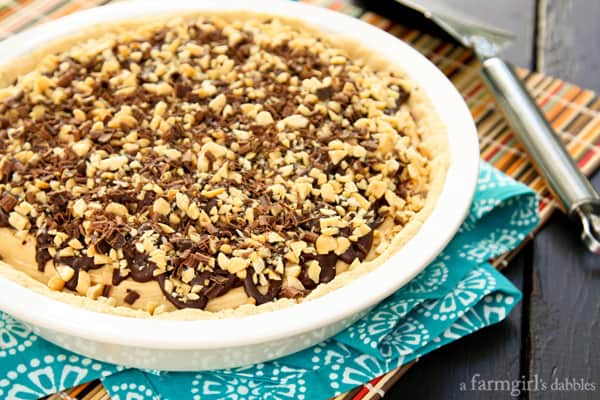 Peanut Butter pie topped with chocolate and chopped peanuts