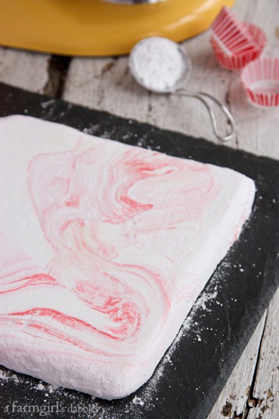 unsliced Marshmallows on a black board