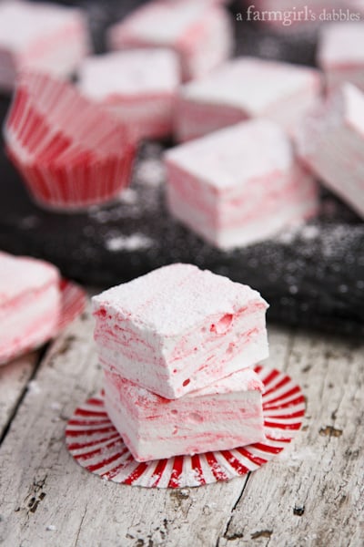 a stack of peppermint Marshmallows on a wood table