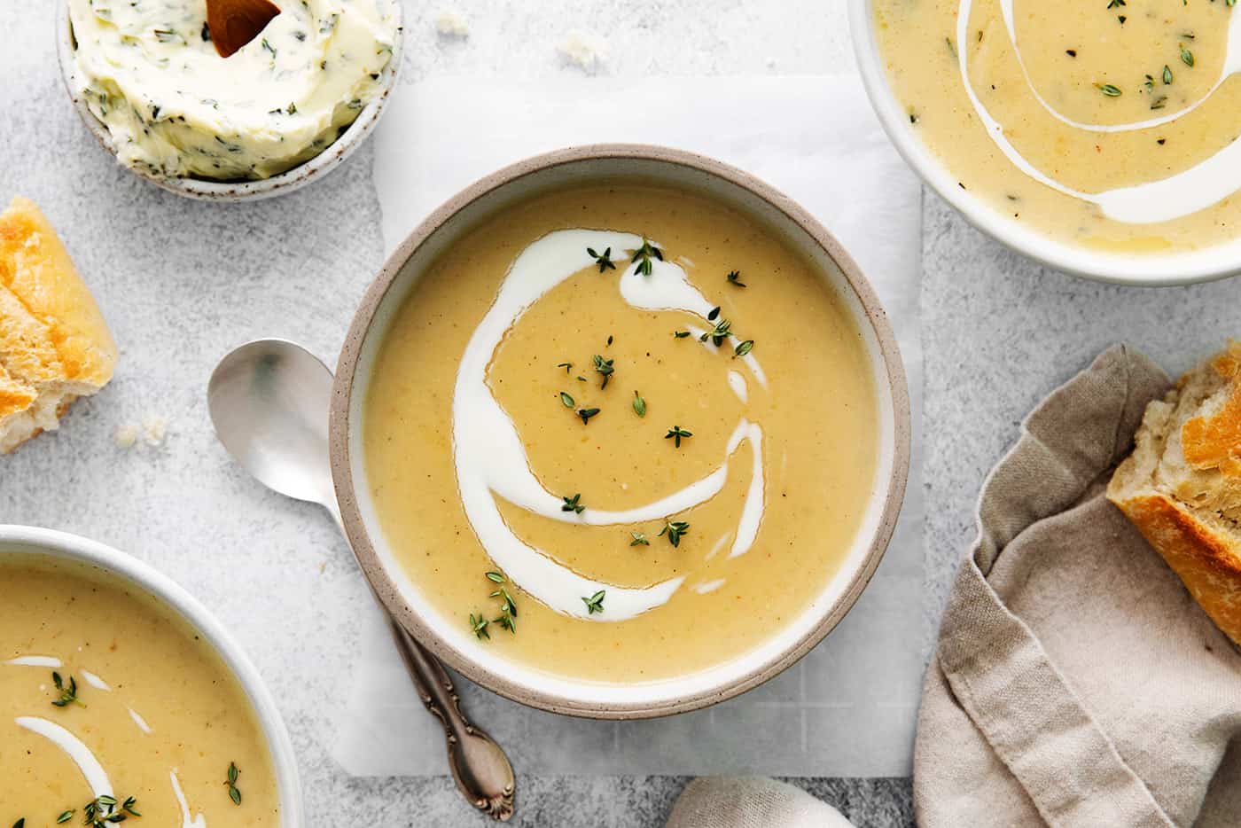 Overhead view of a bowl of creamy potato soup