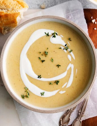 Overhead view of a bowl of creamy potato soup