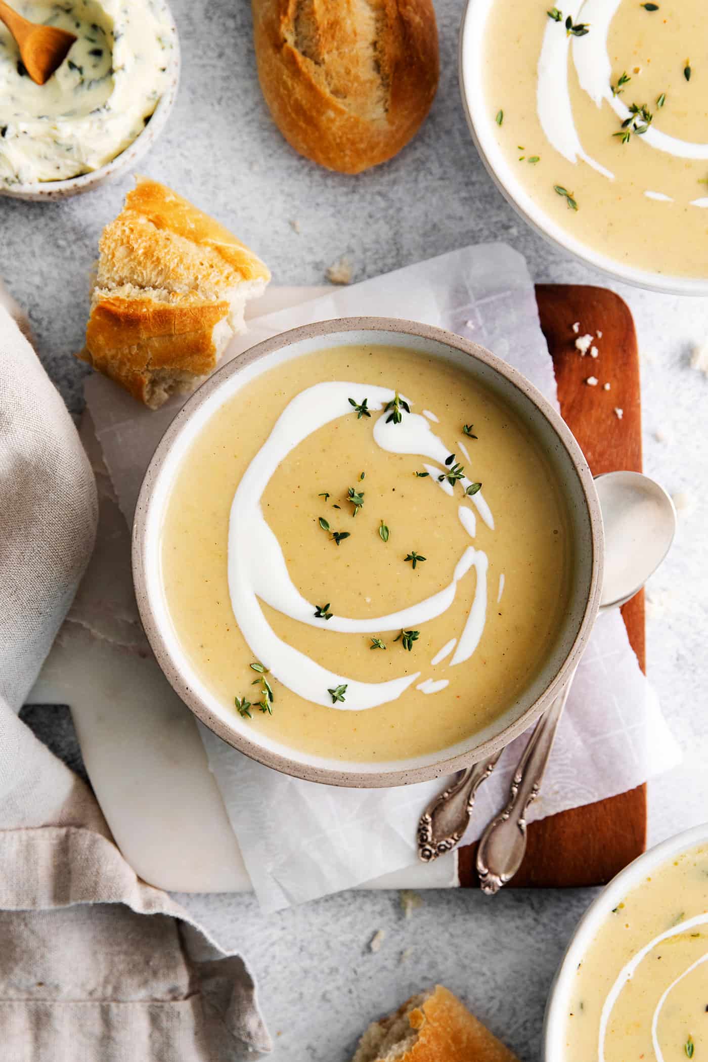 Overhead view of a bowl of creamy potato soup