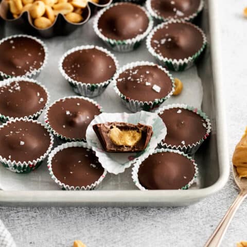 Homemade peanut butter cups on a baking sheet