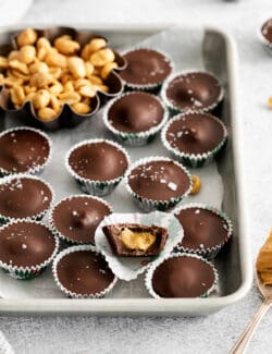 Homemade peanut butter cups on a baking sheet