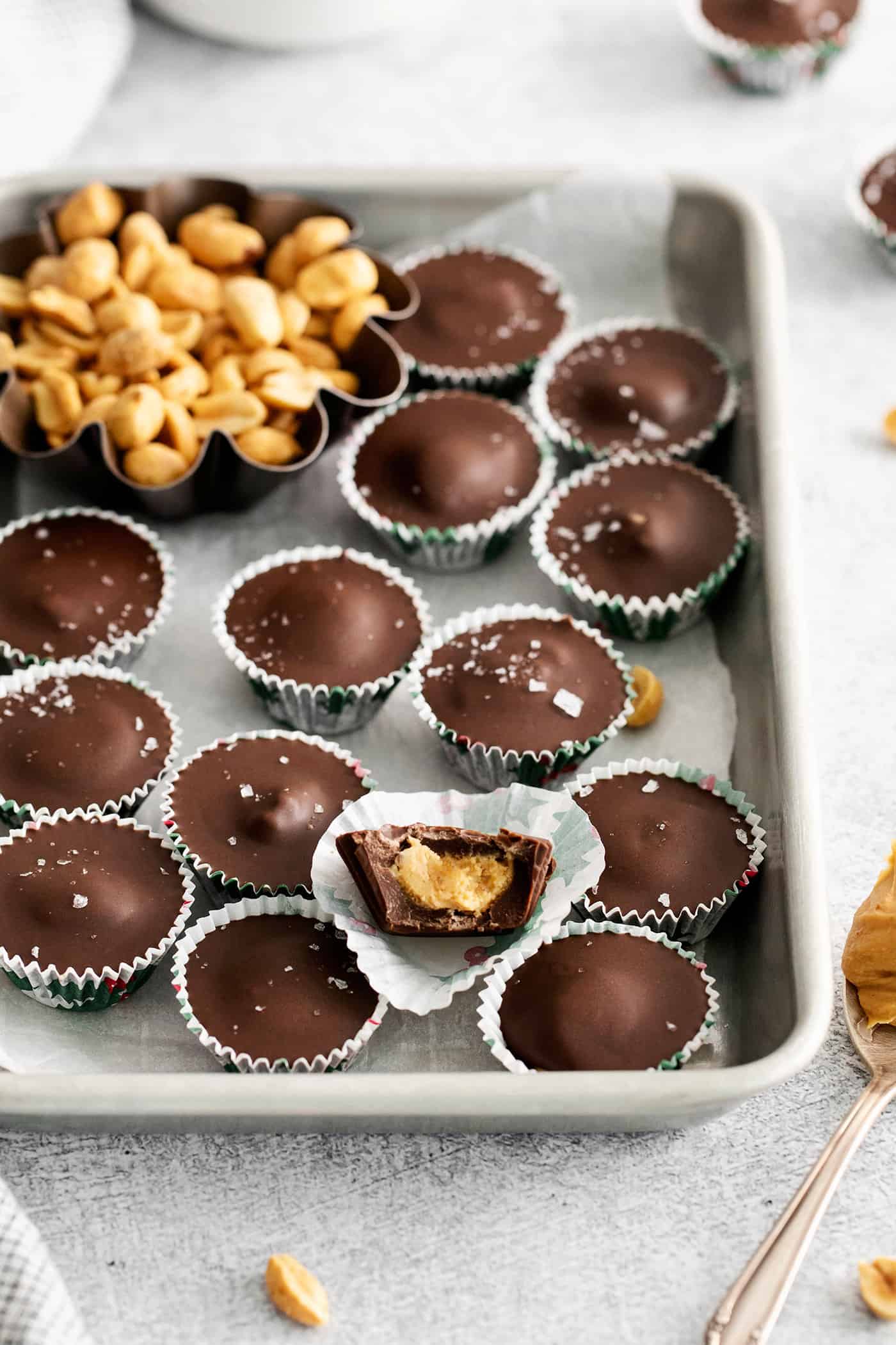 Homemade peanut butter cups on a baking sheet