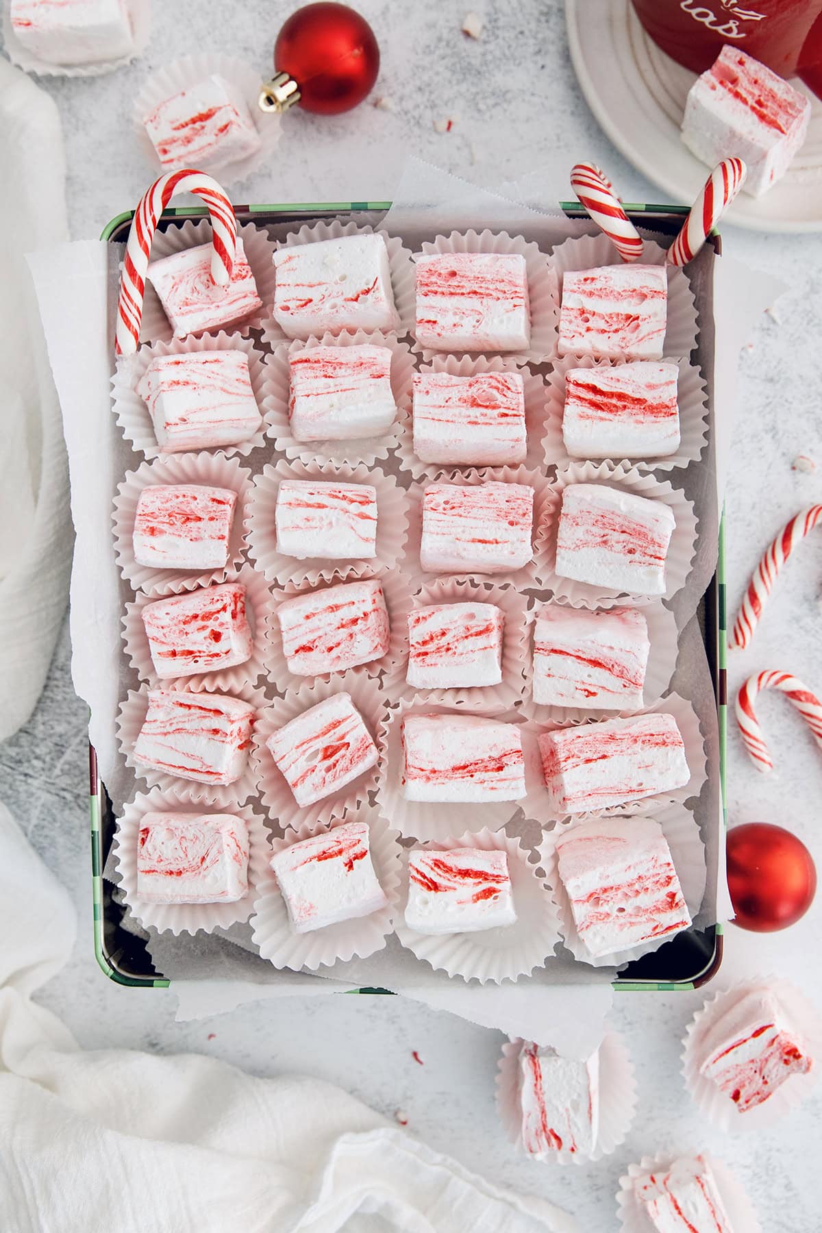 Box of homemade peppermint marshmallows in cupcake wrappers.