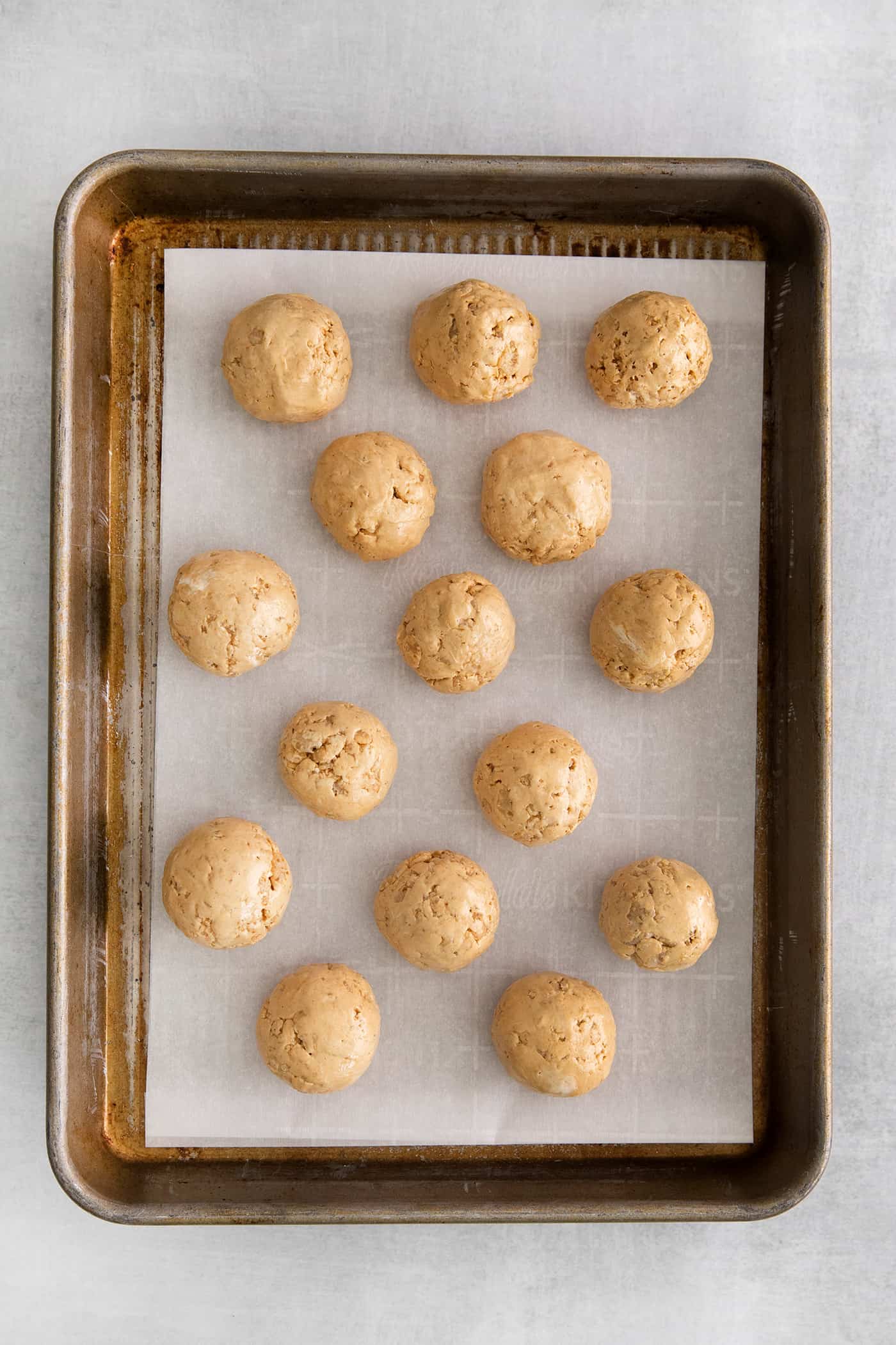 Peanut butter balls on a baking sheet