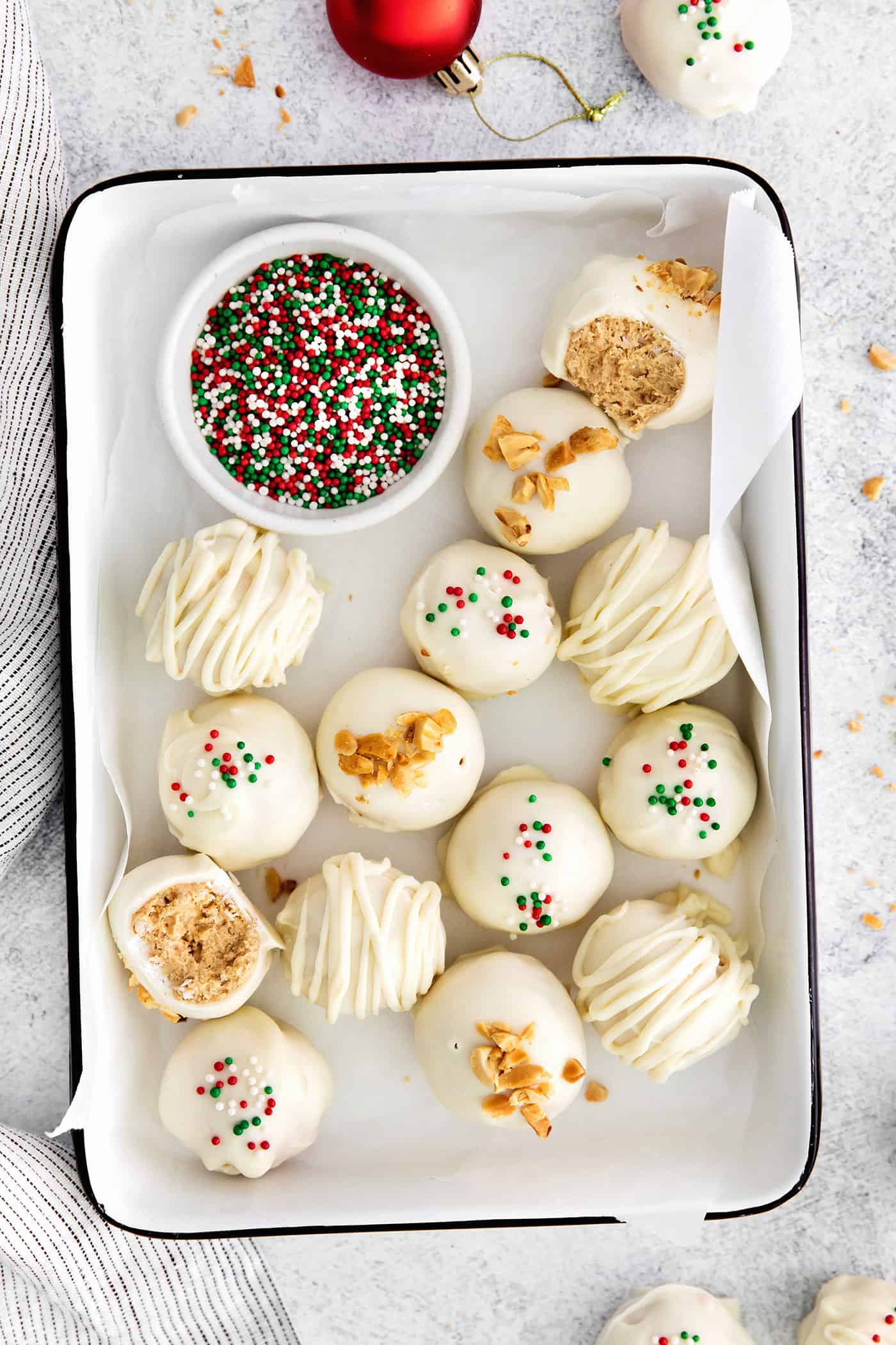 Overhead view of peanut butter balls with Christmas sprinkles