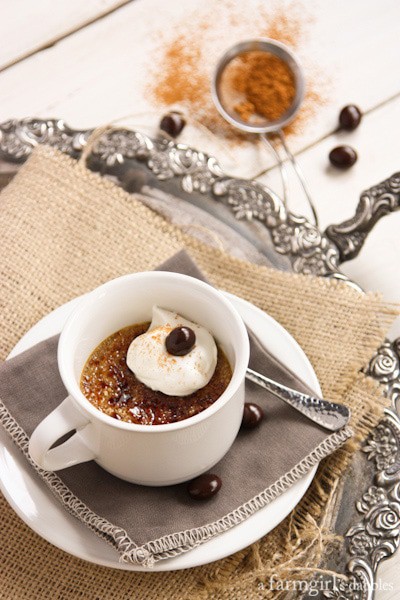 Cappuccino Crème Brûlée in a white teacup and topped with whipped cream