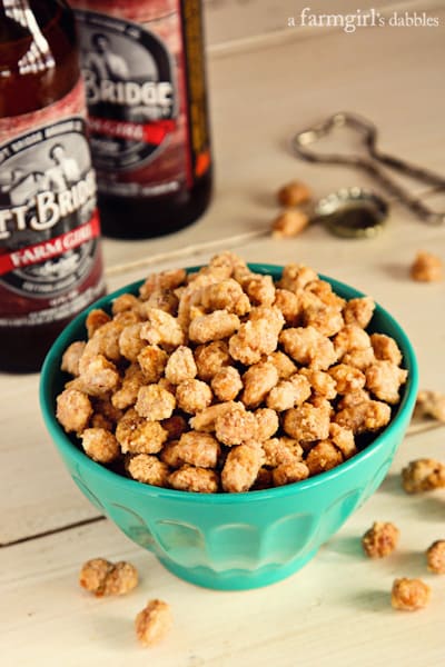 a blue bowl of Beer Nuts with two bottles of beer
