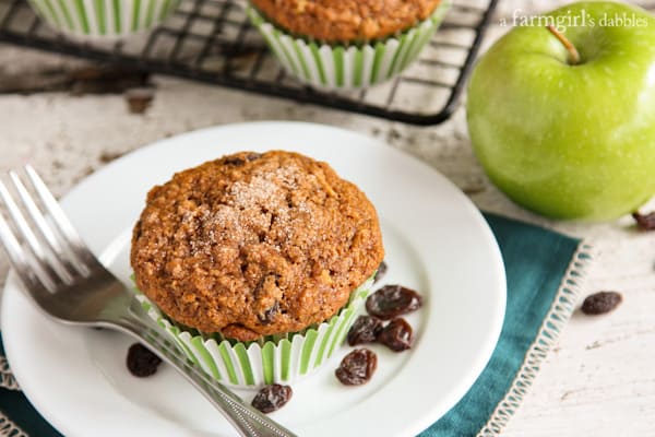 a Muffin on a white plate with a fork