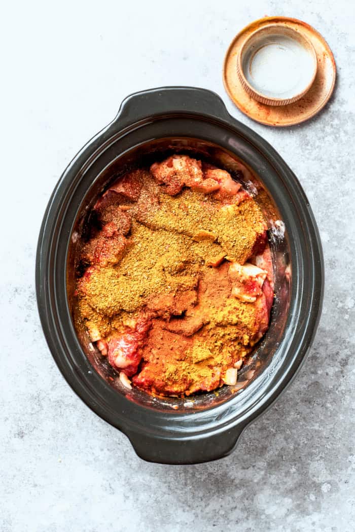 Overhead view of beef curry in crockpot before cooking