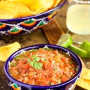 a blue painted bowl of Salsa with tortilla chips