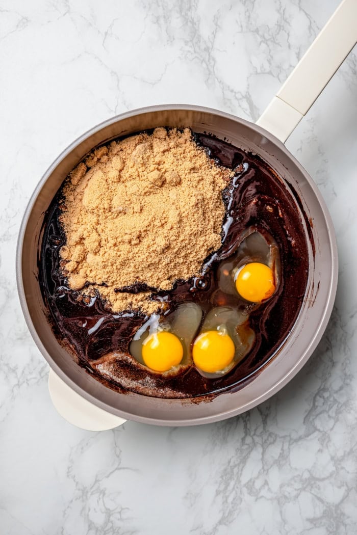 Ingredients for cherry brownies in pan before stirring.
