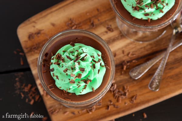 chocolate pudding topped with buttercream and shaved chocolate