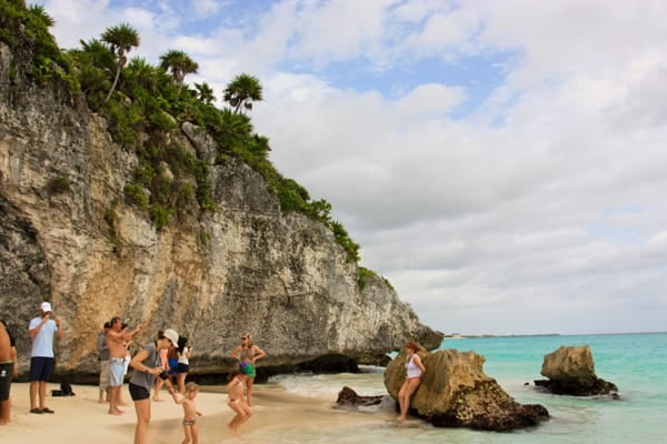 a beach surrounded by cliffs