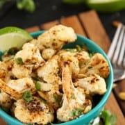 a blue bowl of Roasted Cauliflower with fresh lime