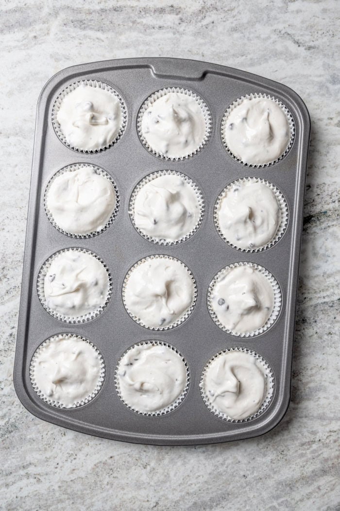 Overhead view of unbaked angel food cupcakes in pan