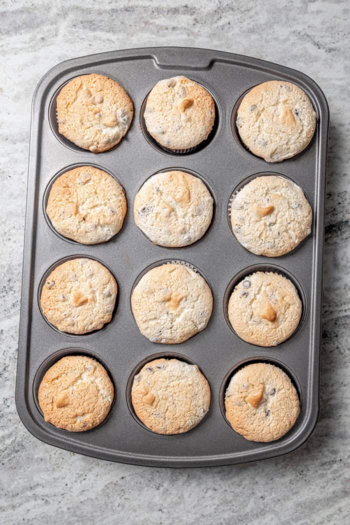 Overhead view of baked angel food cupcakes in pan