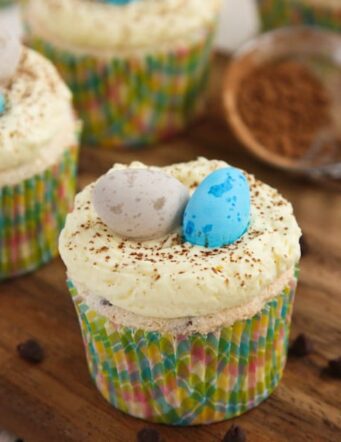 These angel food cupcakes are filled with chocolate chips, topped with buttercream icing, and decorated with Easter candy.