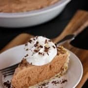 A slice of Chocolate French Silk Pie on a white plate